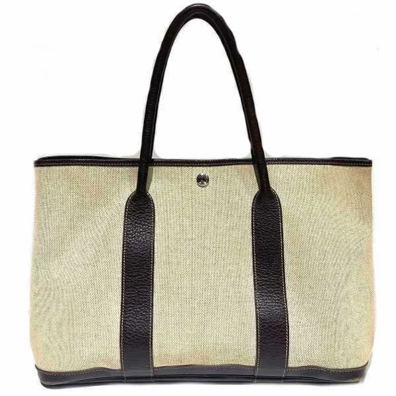 Small handle bags perfect for quick trips -Hermes Garden   Canvas Leather Tote Bag (Pre-Owned)