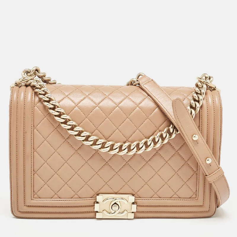 Handle bags with minimalist sleek silhouettes -Chanel Beige Quilted Leather New Medium Boy Flap Bag