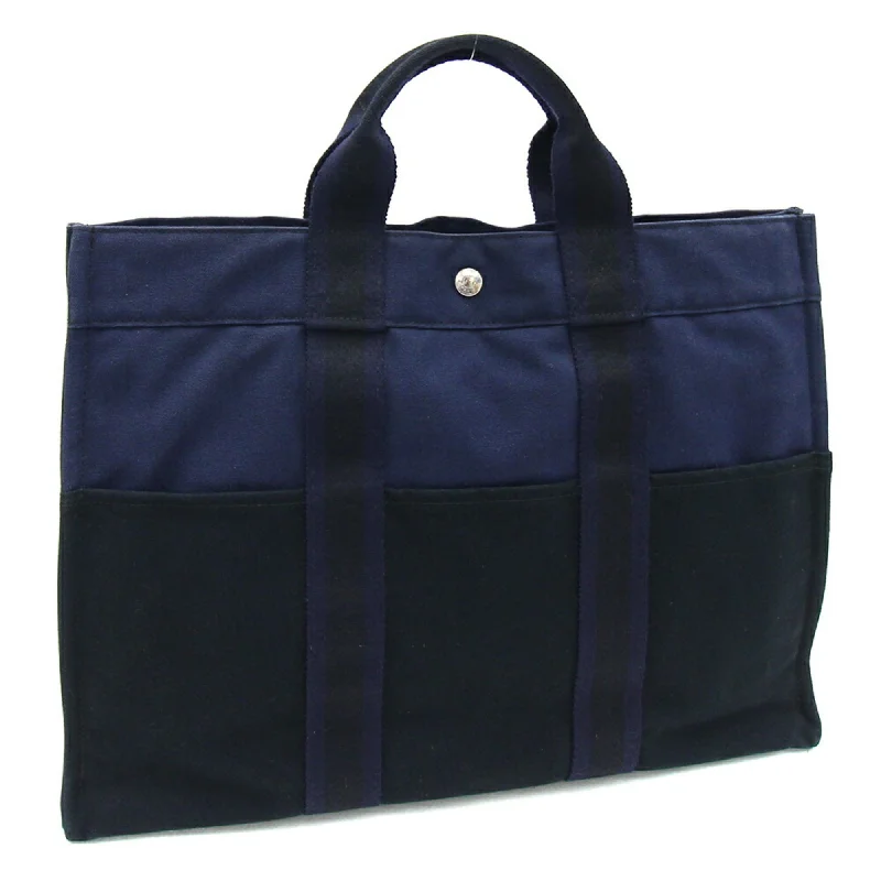 Handle bags with laptop sleeves for work -Hermes  Navy Canvas Handbag Tote Bag (Pre-Owned)